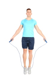 Photo of Full length portrait of young sportive man training with jump rope on white background