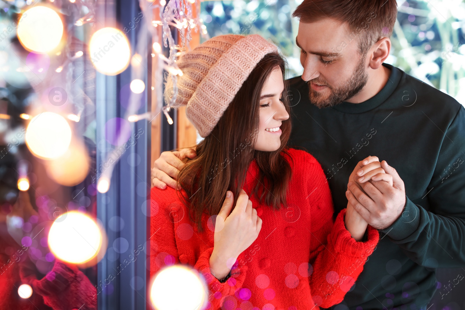 Image of Lovely couple spending time together in cafe. Winter vacation