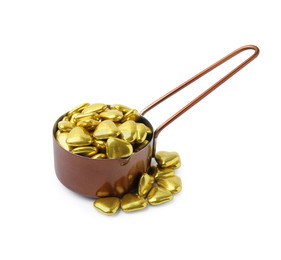 Photo of Metal scoop and delicious heart shaped candies on white background