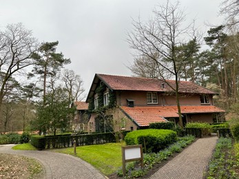 Photo of Luxury hotel, pathway and beautiful trees outdoors