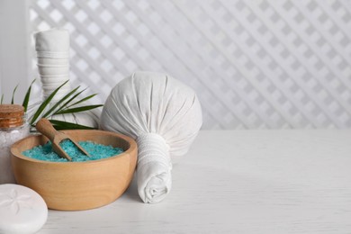 Photo of Spa composition with care products on white wooden table. Space for text