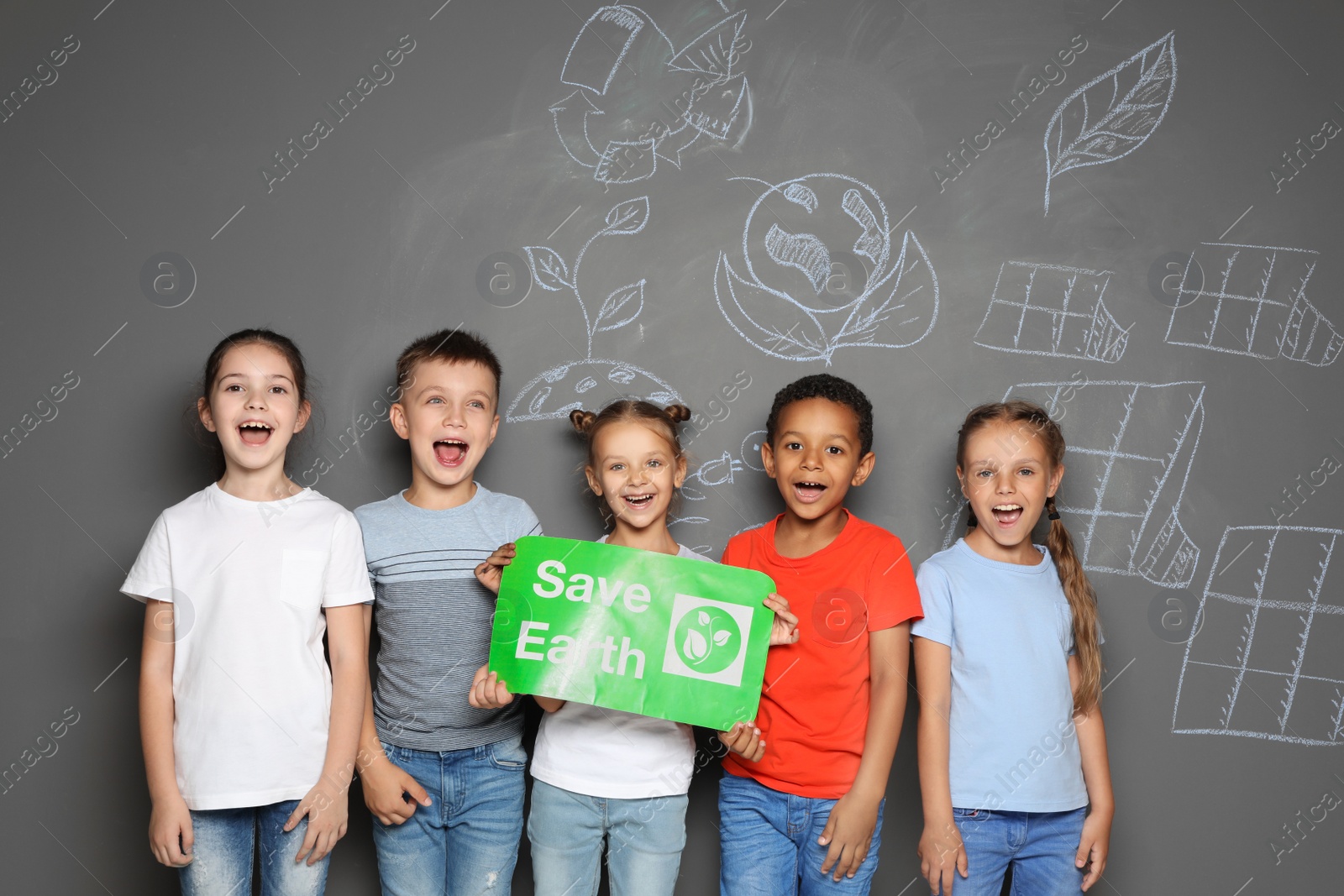 Photo of Little school children with placard SAVE EARTH and drawings on grey background