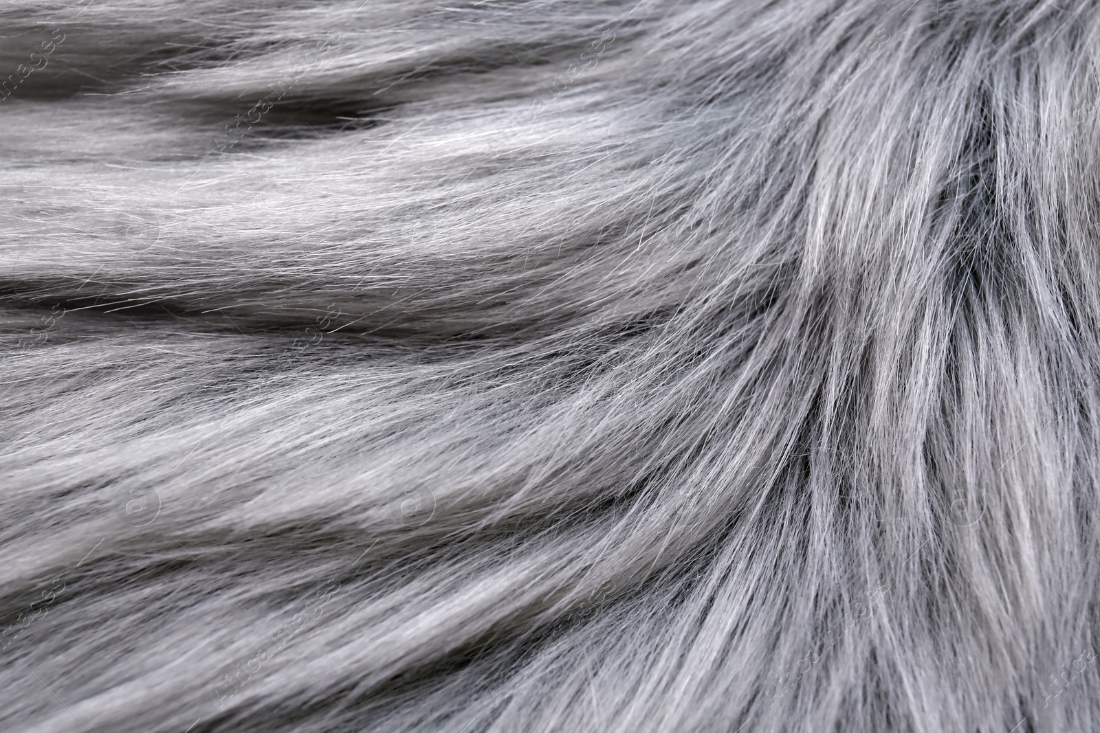 Photo of Grey faux fur as background, closeup view