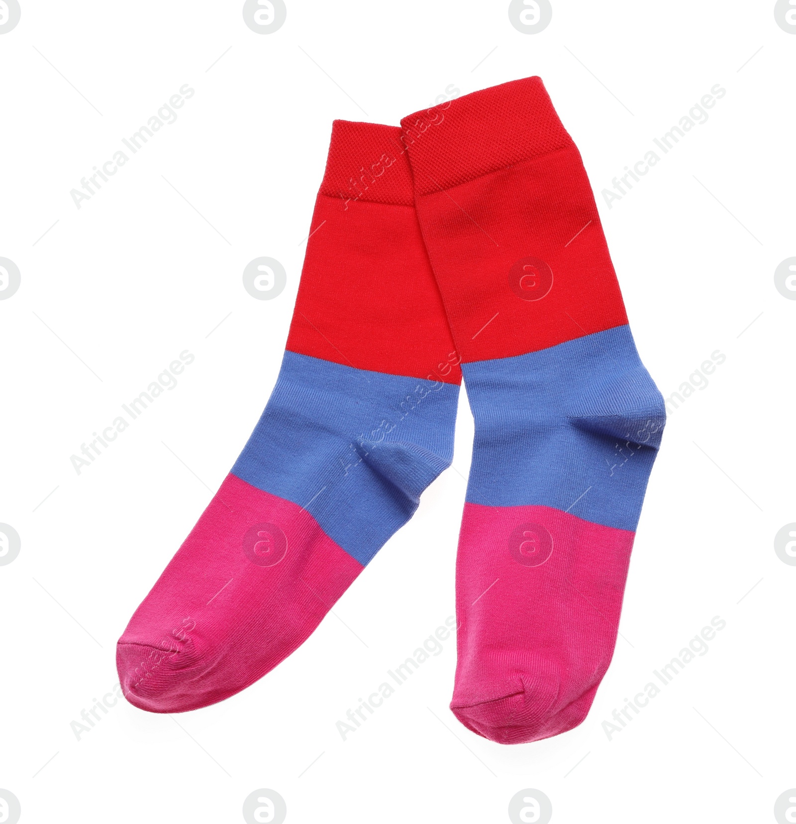 Photo of Striped socks on white background, top view