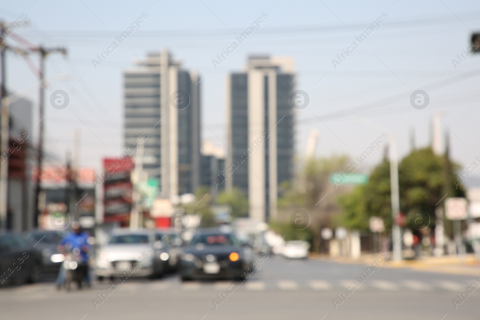 Photo of San Pedro Garza Garcia, Mexico – March 20, 2023: Blurred view of road with cars and buildings, bokeh effect
