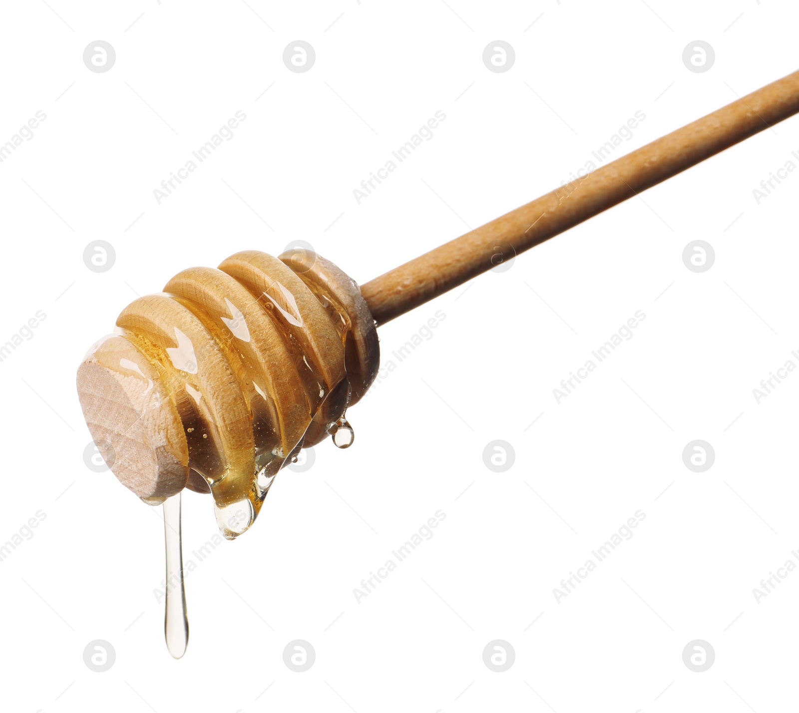 Photo of Natural honey dripping from dipper on white background