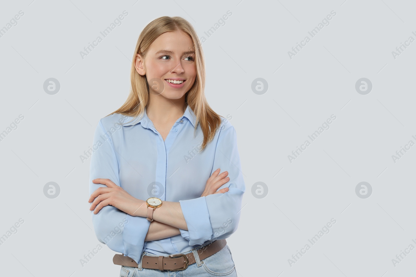 Photo of Portrait of beautiful young woman in stylish blouse on white background. Space for text