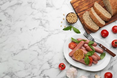 Photo of Flat lay composition with vegetarian sausages and vegetables on white marble table. Space for text