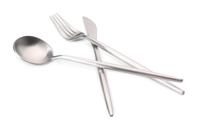 Shiny silver fork, knife and spoon isolated on white. Luxury cutlery set