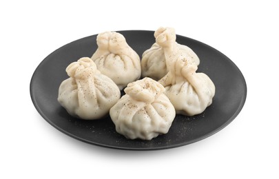 Photo of Plate with tasty fresh khinkali (dumplings) and spices isolated on white. Georgian cuisine