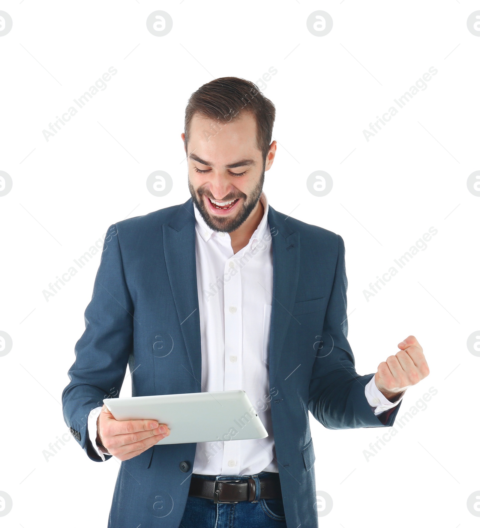 Photo of Emotional businessman in office wear with tablet celebrating victory on white background