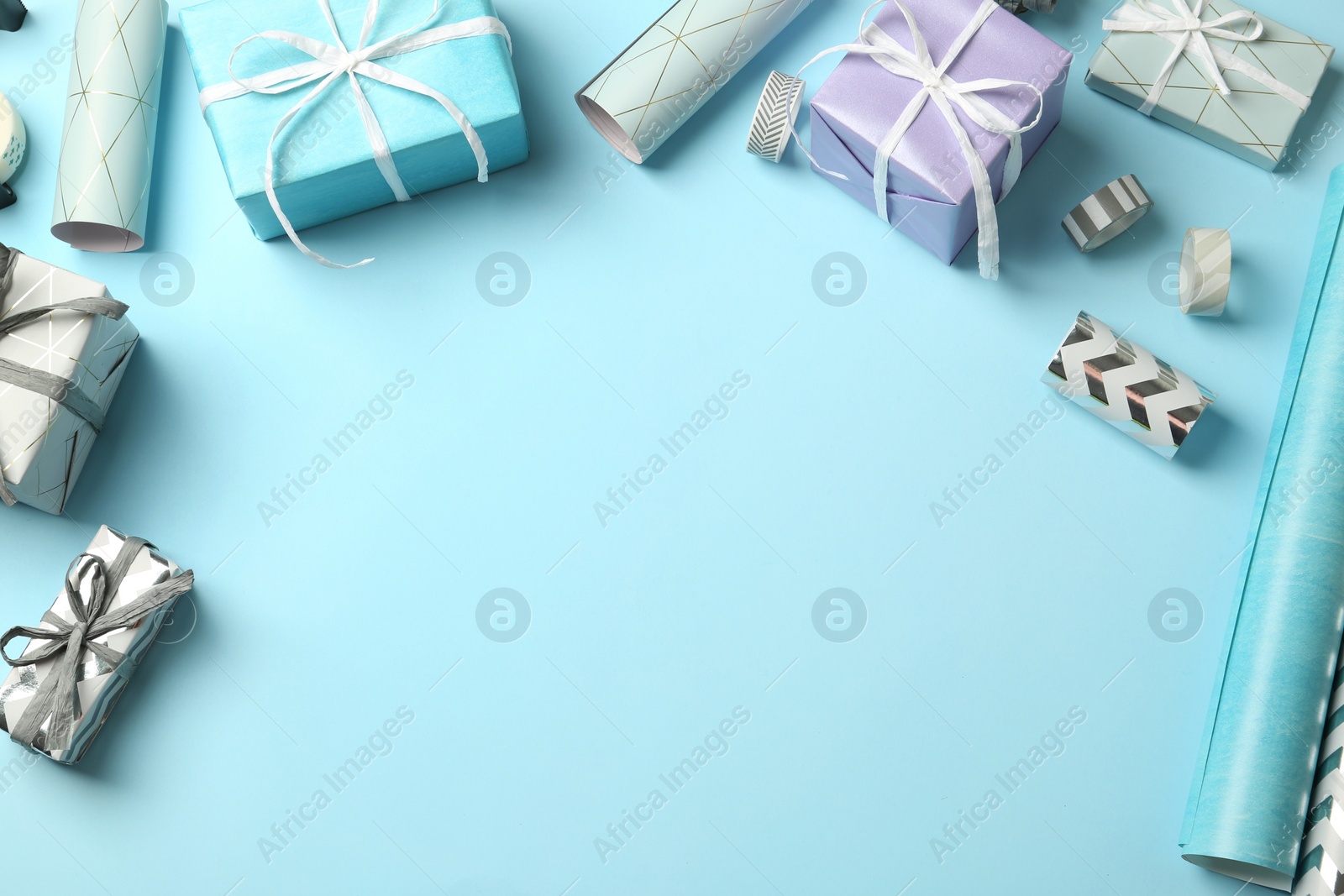 Photo of Beautiful gift boxes and tools for decor on color background. Space for text