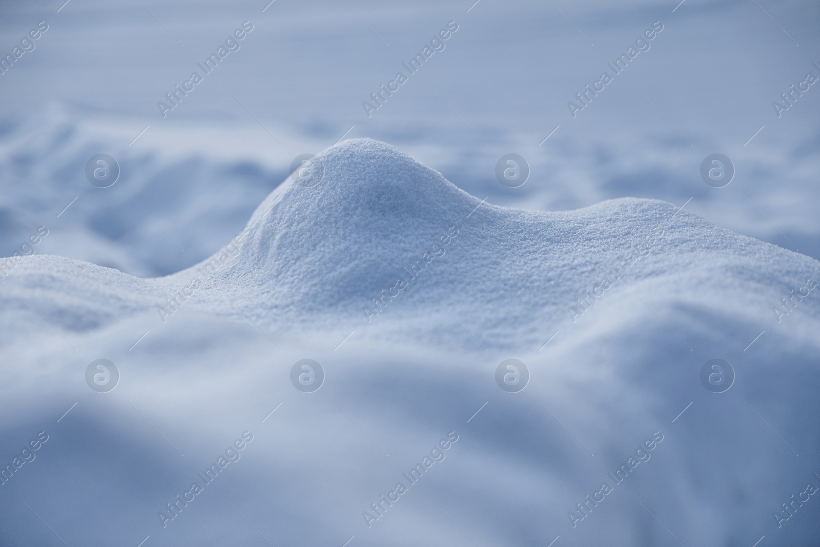 Photo of Beautiful snowdrift as background, closeup view. Winter weather