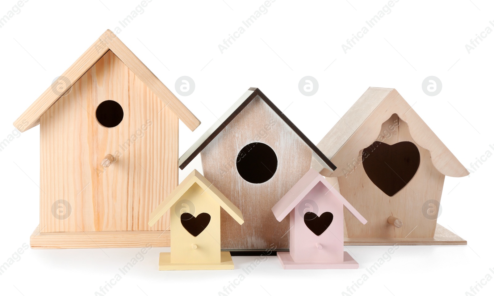 Photo of Many different bird houses on white background