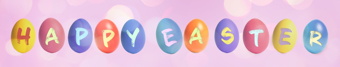 Image of Happy Easter. Colorful dyed eggs on pink background, banner design