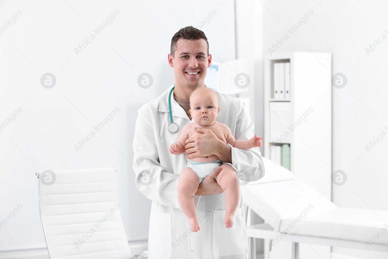 Photo of Children's doctor with cute baby in hospital