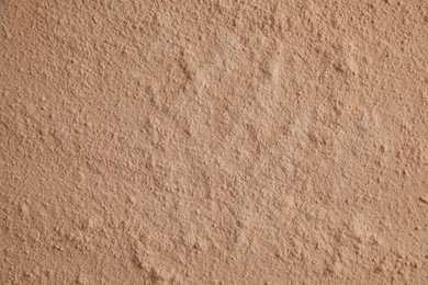 Photo of Loose face powder as background, top view