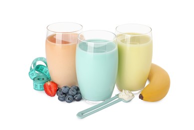 Tasty shakes, banana, berries, measuring tape and powder isolated on white. Weight loss