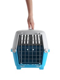 Photo of Woman holding light blue pet carrier on white background, closeup