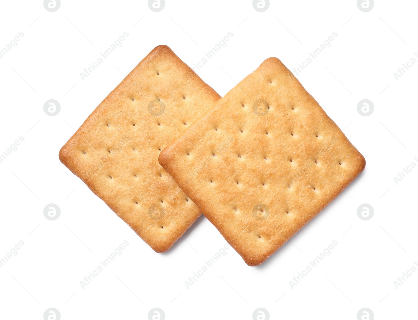 Photo of Two crispy crackers isolated on white, top view. Delicious snack