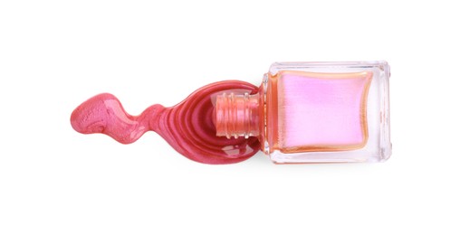 Overturned bottle of bright nail polish isolated on white, top view