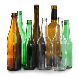 Photo of Many different glass bottles on white background. Recycling rubbish