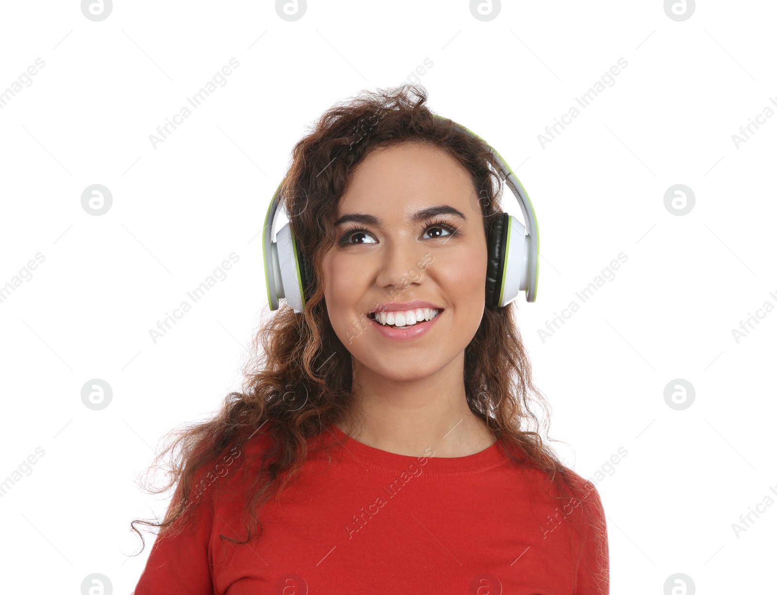 Photo of African-American girl listening to music with headphones on white background