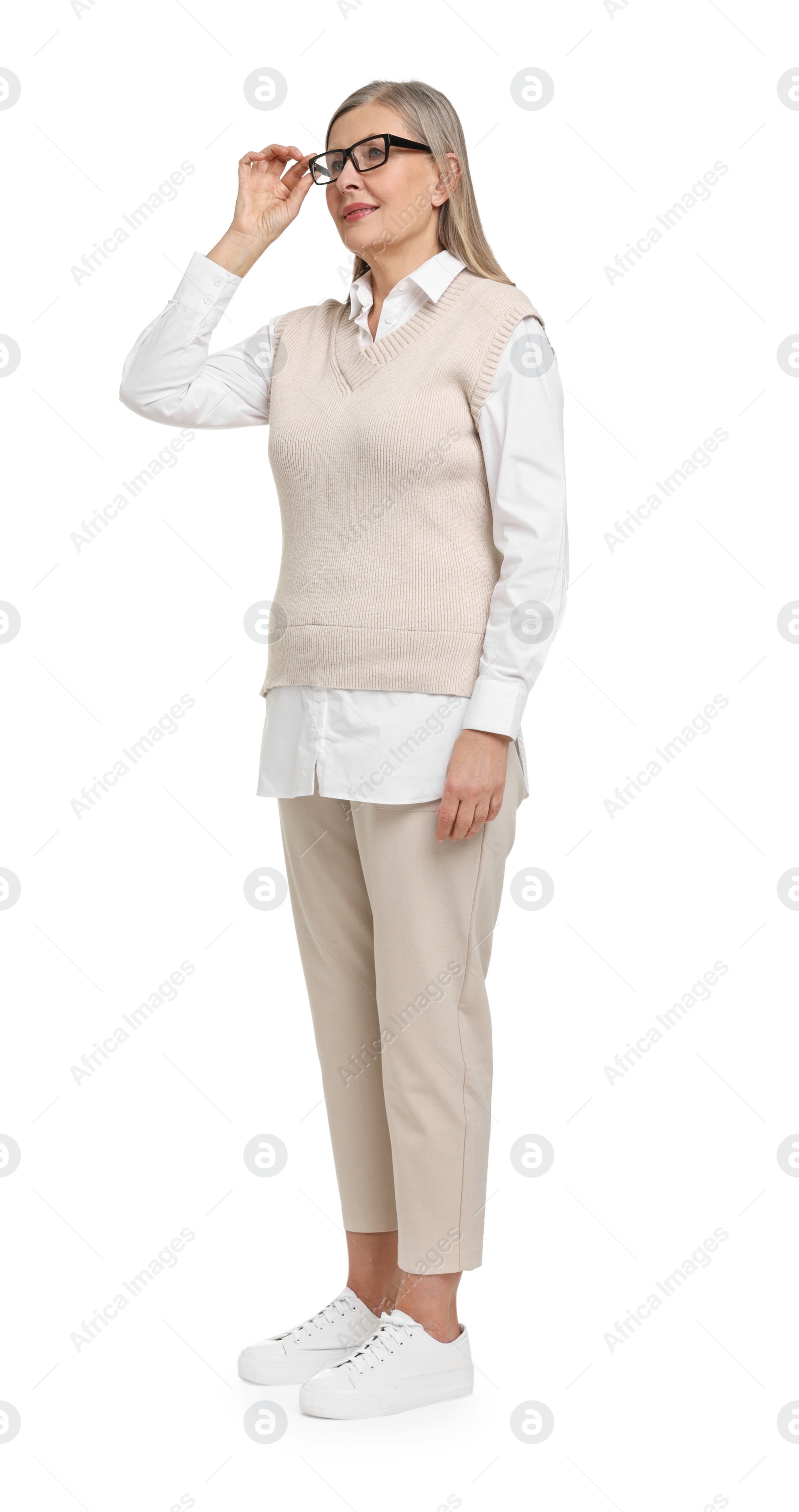 Photo of Full length portrait of senior woman on white background