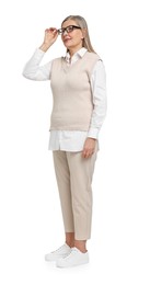 Full length portrait of senior woman on white background