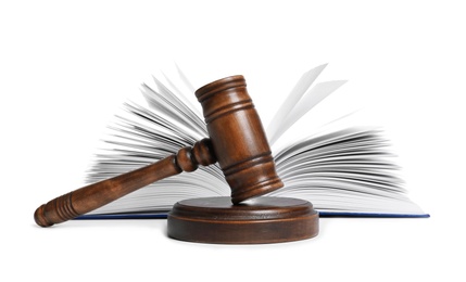 Photo of Wooden gavel and book on white background. Law concept