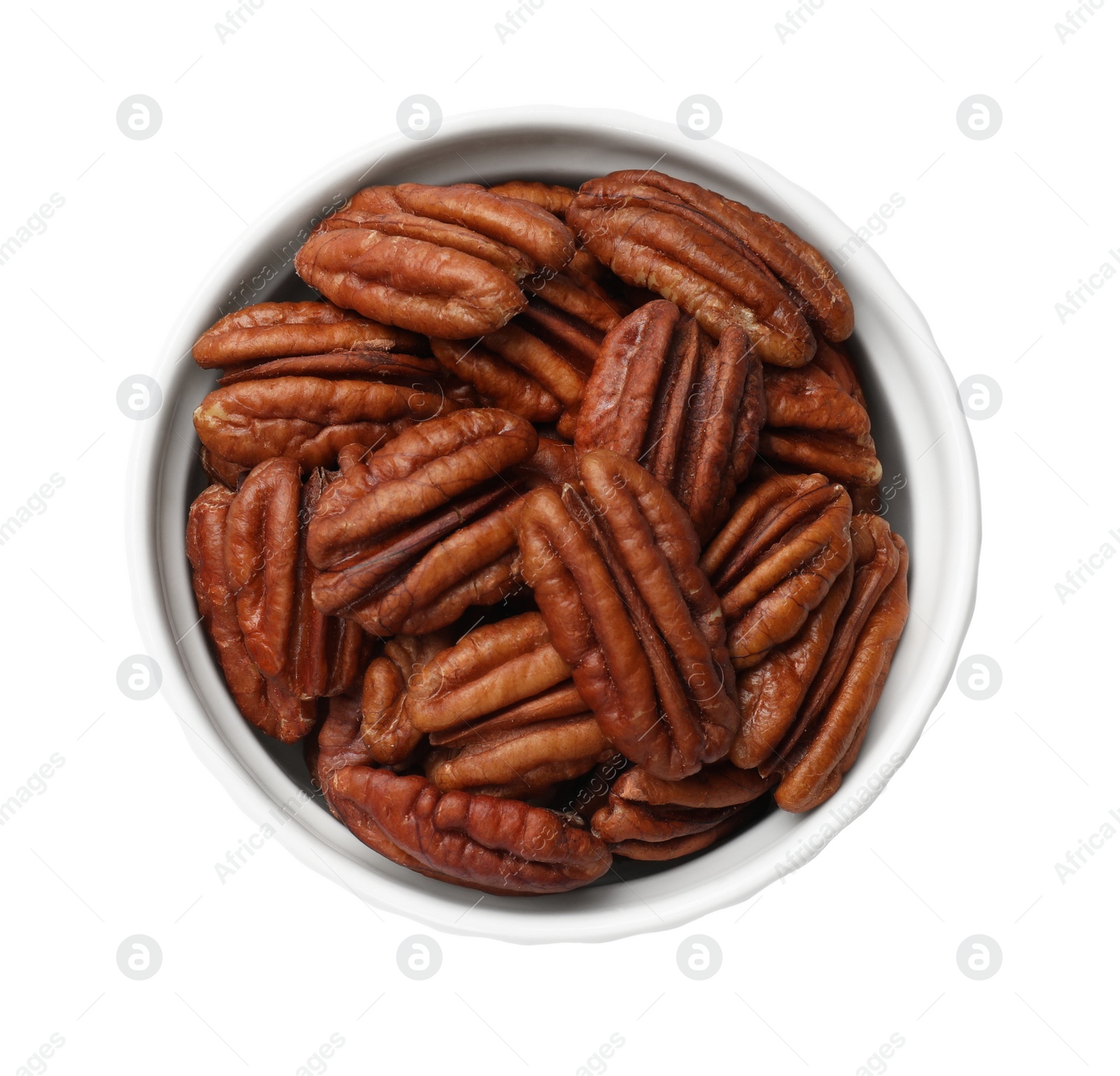 Photo of Tasty pecan nuts in bowl isolated on white, top view