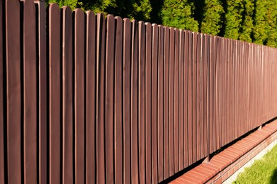 Beautiful wooden fence on sunny day outdoors