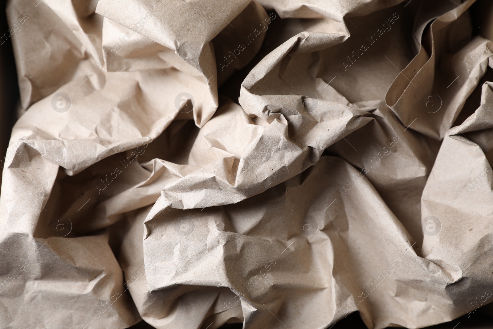 Photo of Crumpled waste paper as background, top view