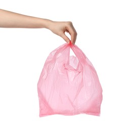 Photo of Woman holding pink plastic bag on white background, closeup