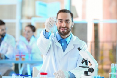 Young scientist working in laboratory. Chemical analysis