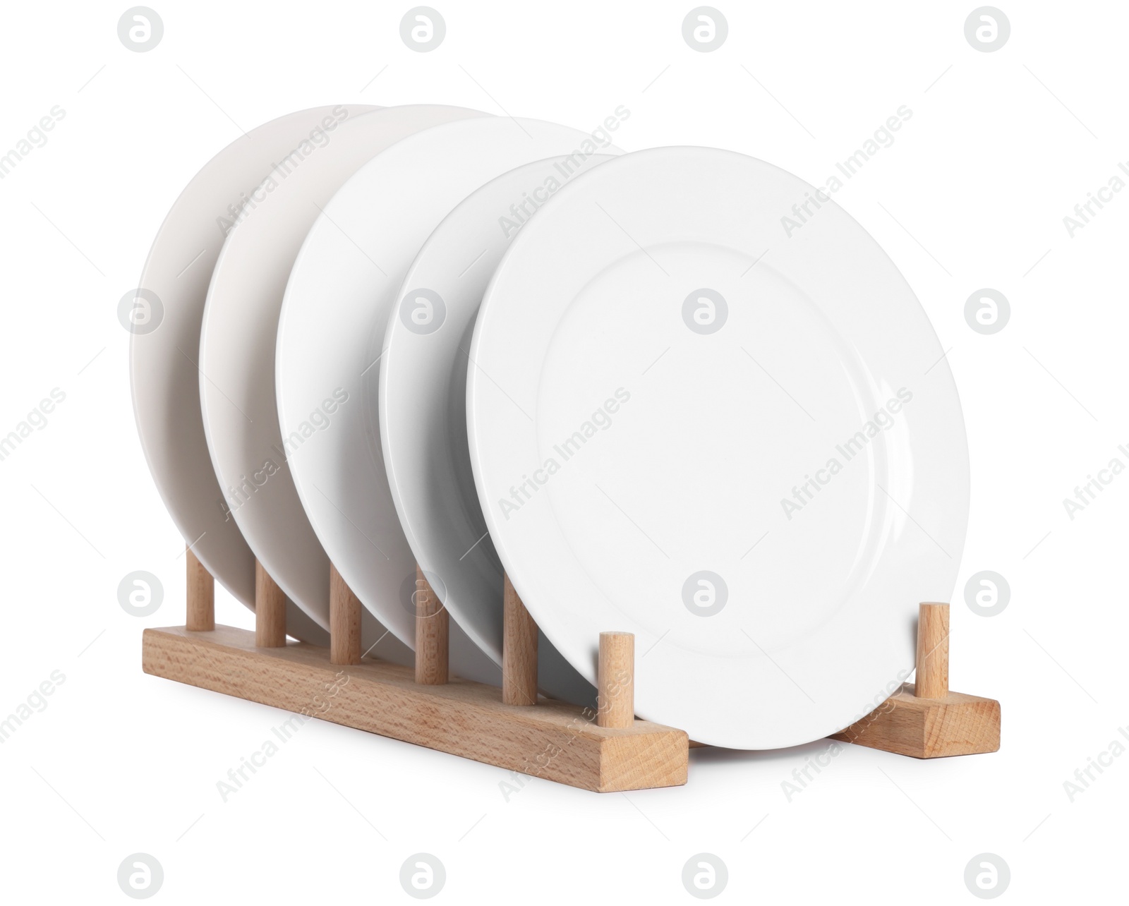 Photo of Many clean plates on wooden stand isolated on white