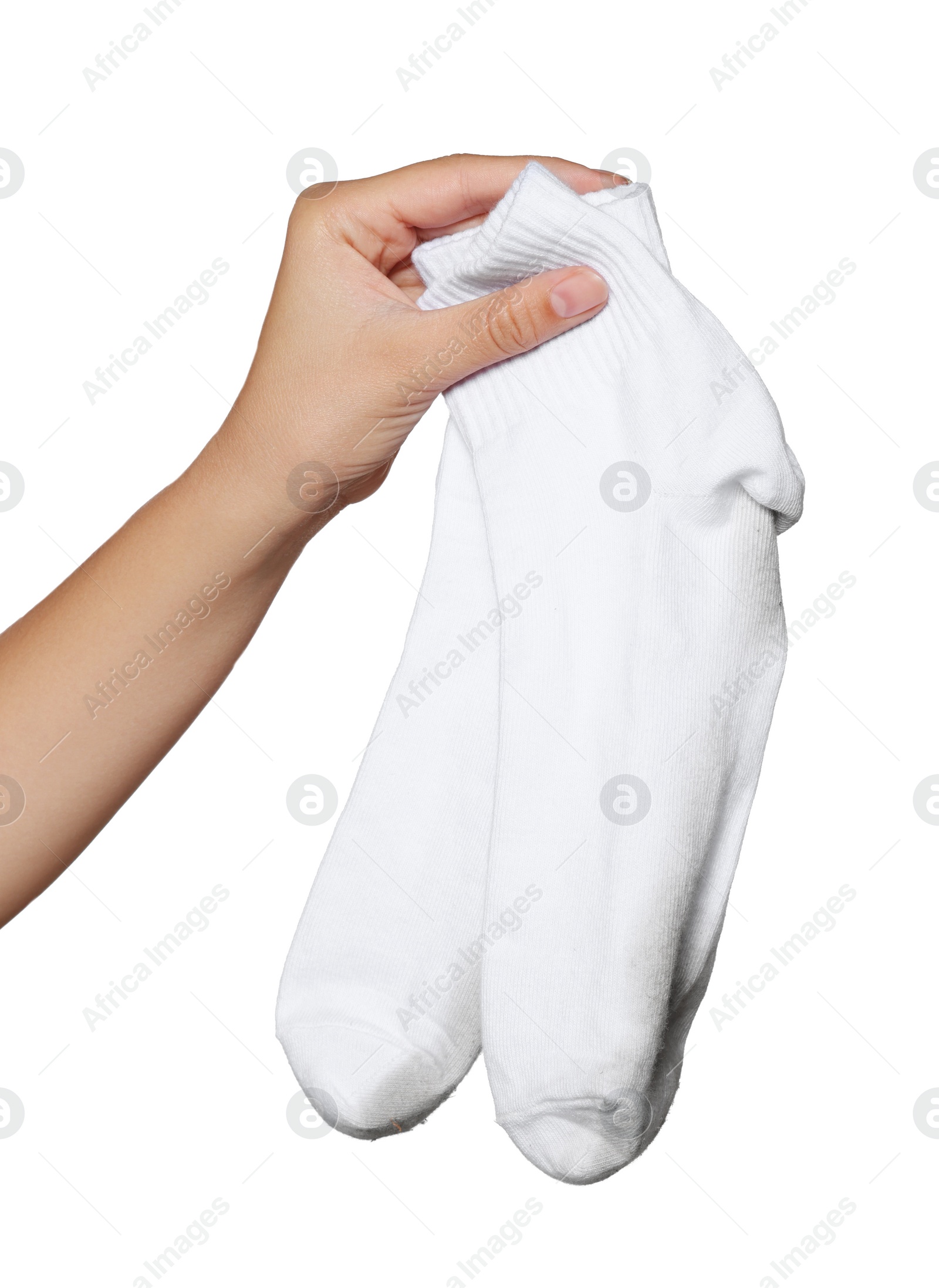 Photo of Woman holding dirty socks on white background, closeup