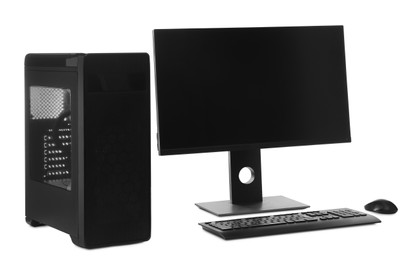 Photo of Modern computer monitor with black screen, system unit, keyboard and mouse on white background