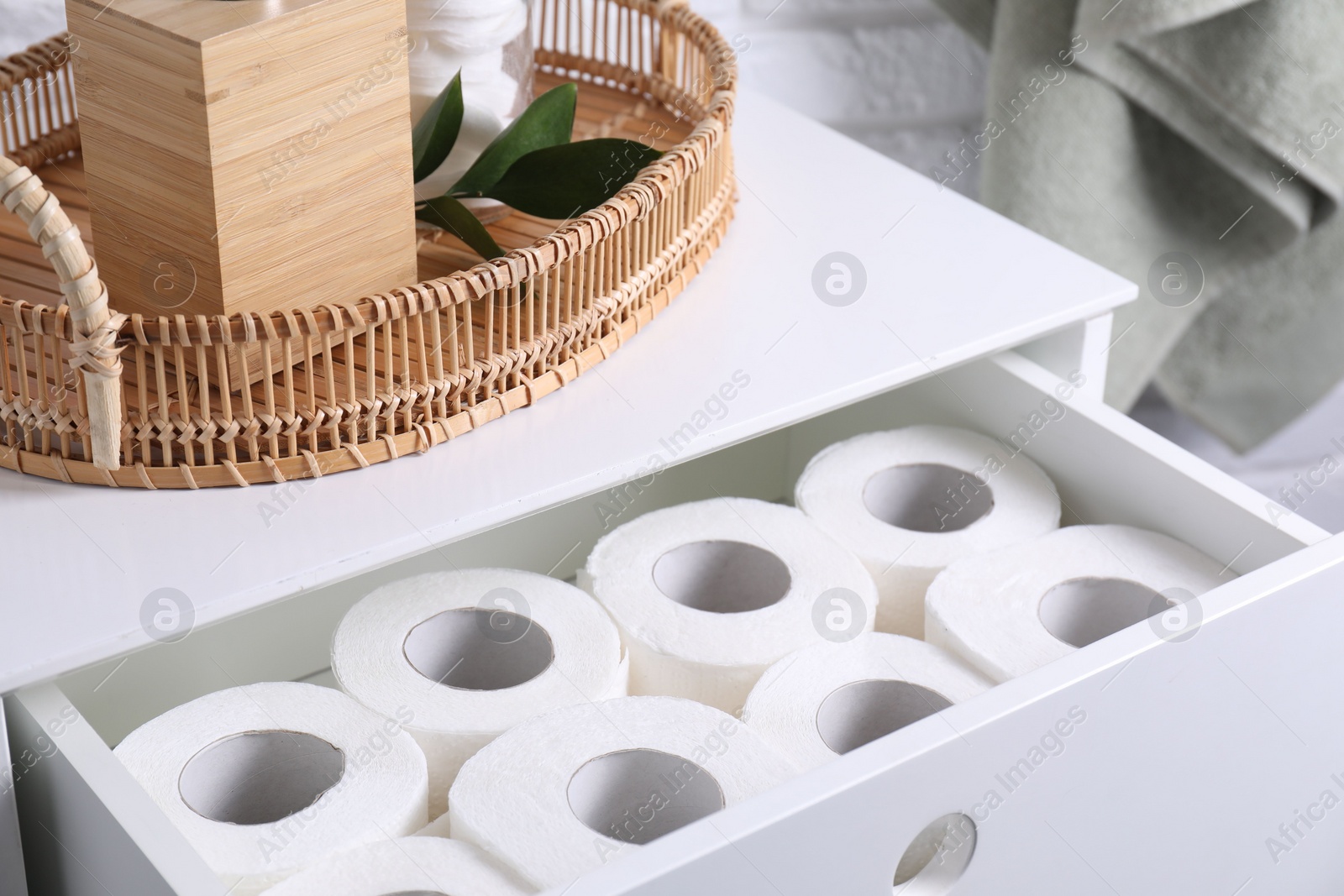 Photo of Many toilet paper rolls in white drawer indoors