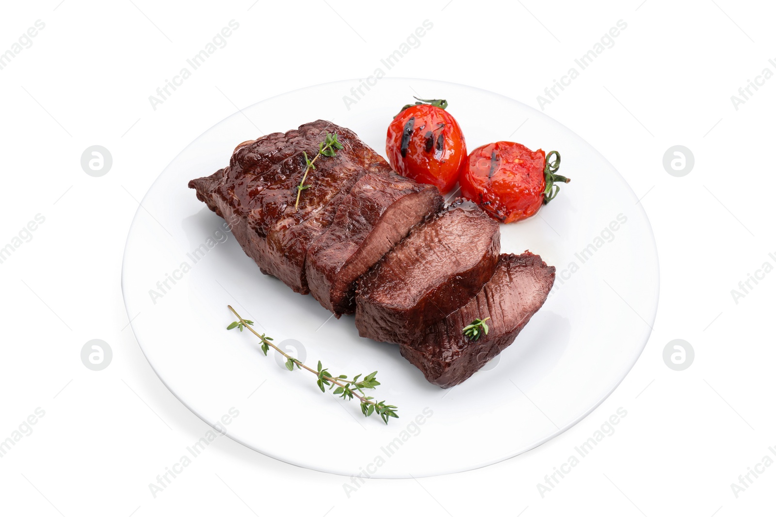 Photo of Plate with delicious beef meat, thyme and tomatoes isolated on white