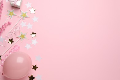 Photo of Flat lay composition with confetti and other party accessories on pink background, space for text. Birthday surprise
