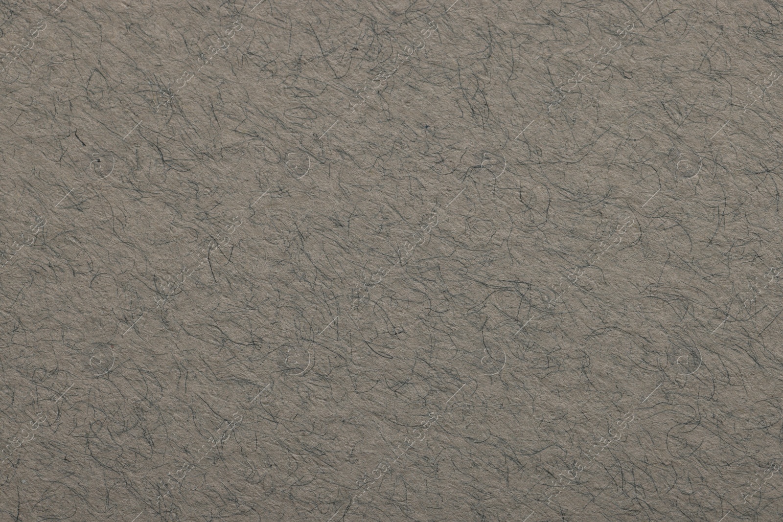 Photo of Texture of grey paper sheet as background, top view