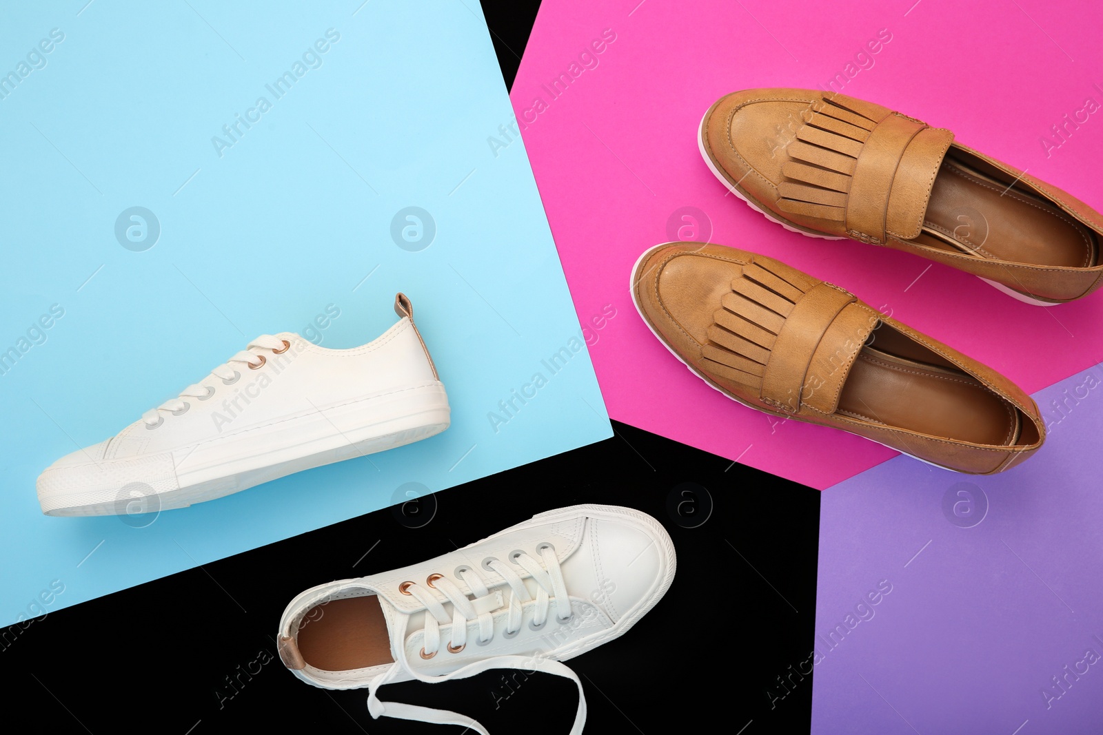 Photo of Different female shoes on color background