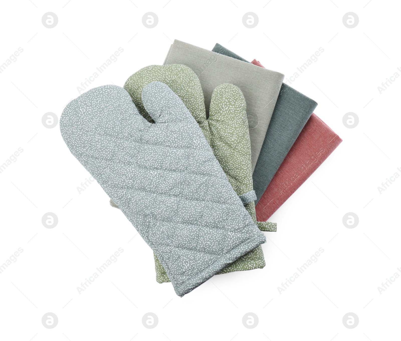 Photo of Kitchen towels and oven gloves for hot dishes on white background, top view