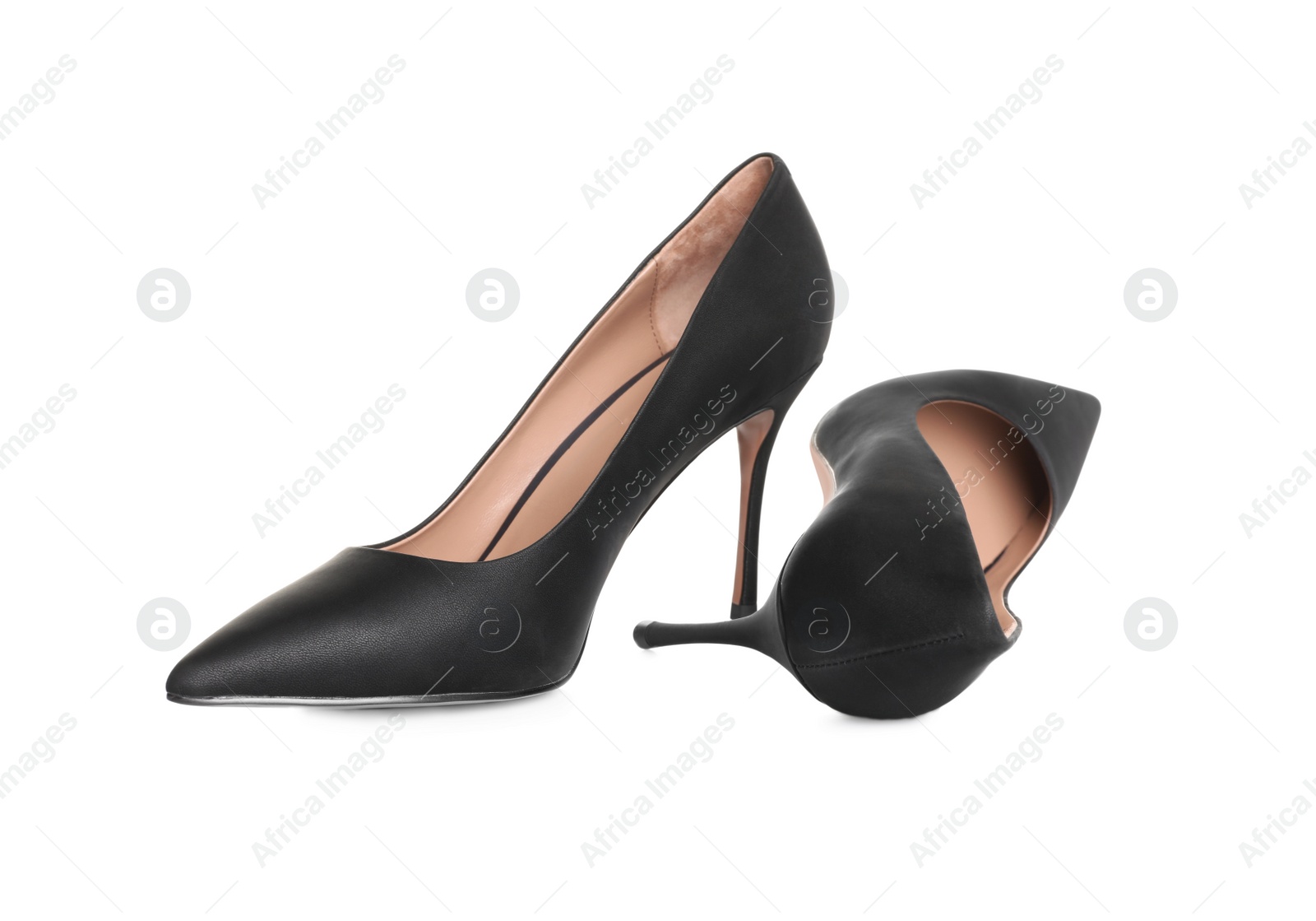 Photo of Pair of elegant black high heel shoes on white background