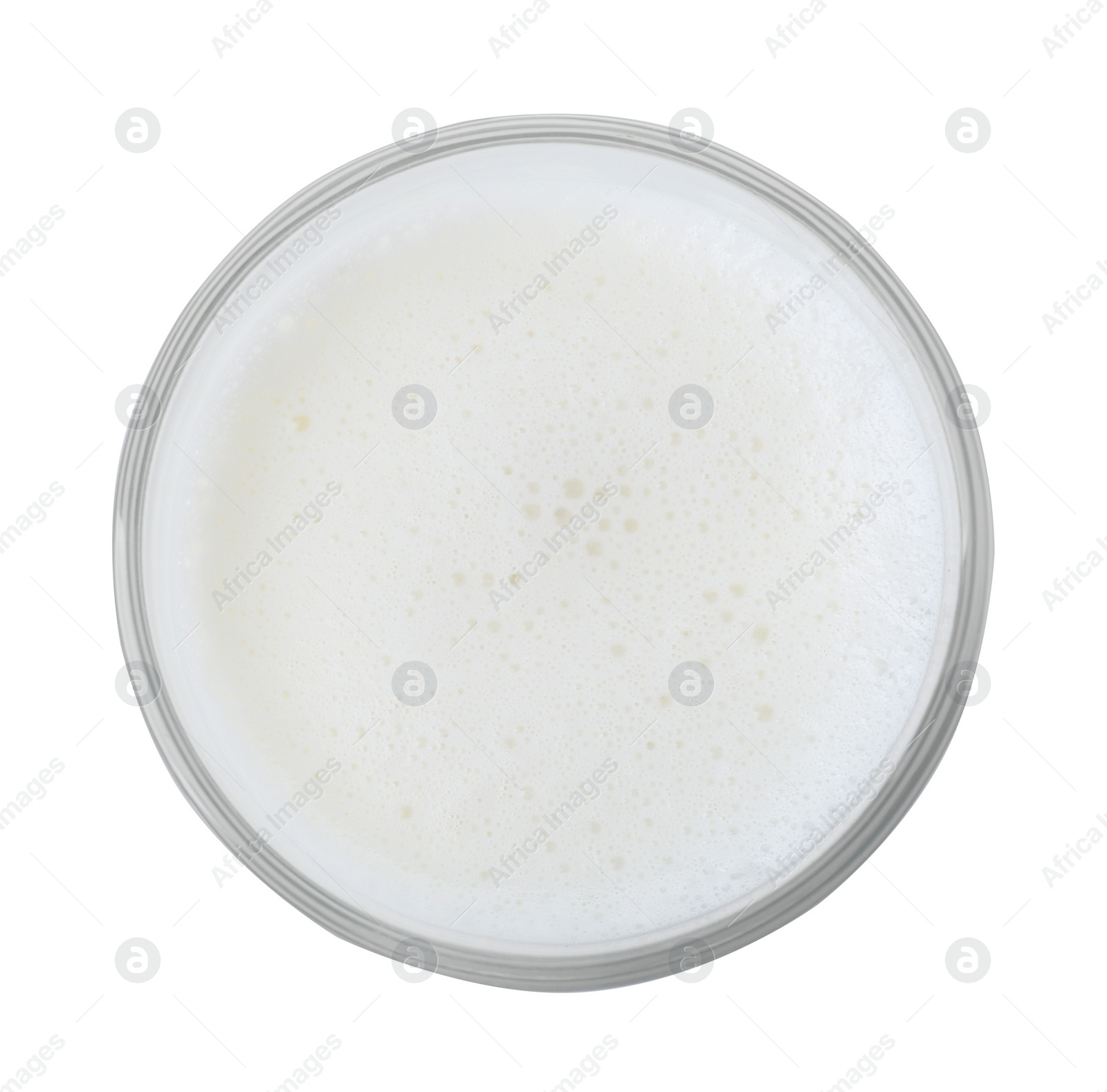 Photo of Glass of fresh milk isolated on white, top view