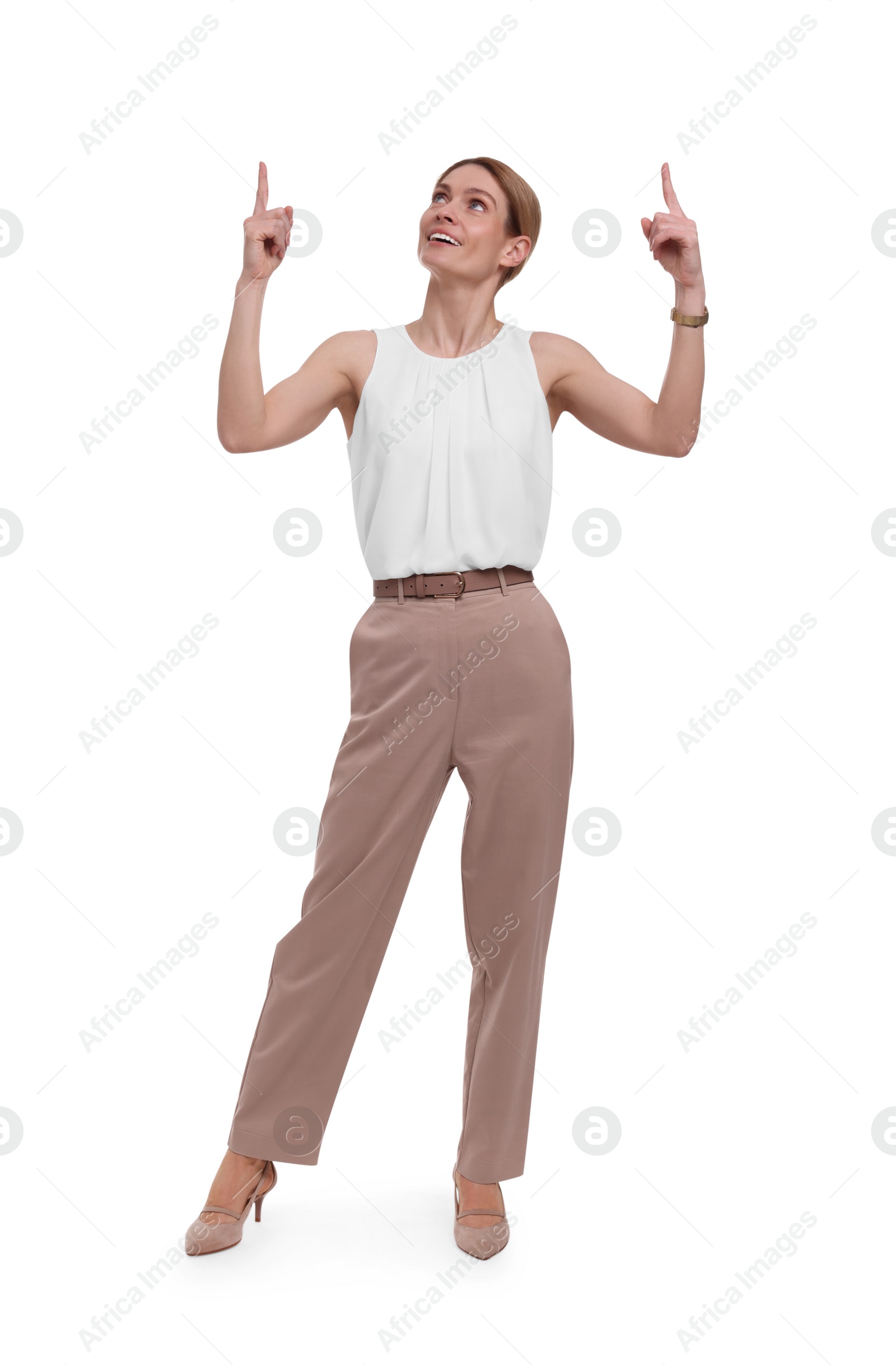 Photo of Beautiful happy businesswoman pointing at something on white background