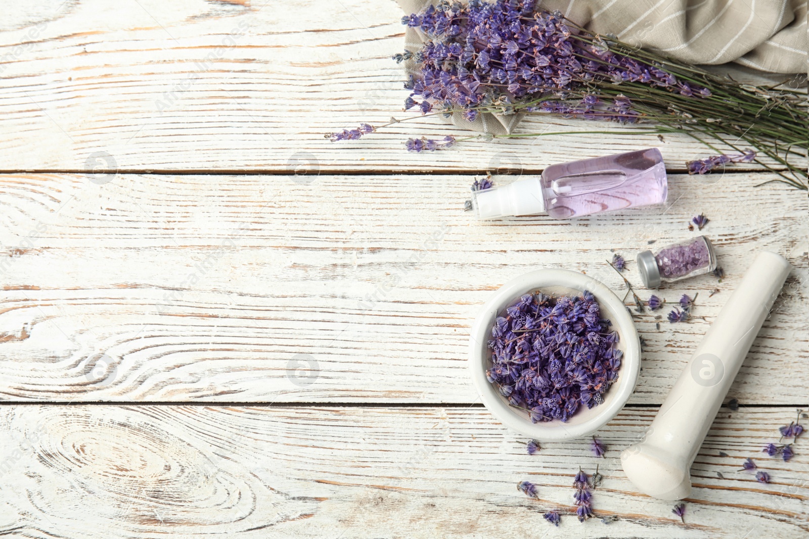 Photo of Flat lay composition with lavender flowers and natural cosmetic on wooden background