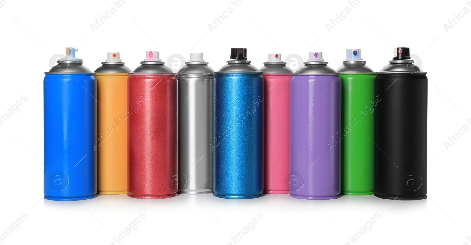 Photo of Cans of different spray paints on white background. Graffiti supplies