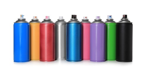 Cans of different spray paints on white background. Graffiti supplies